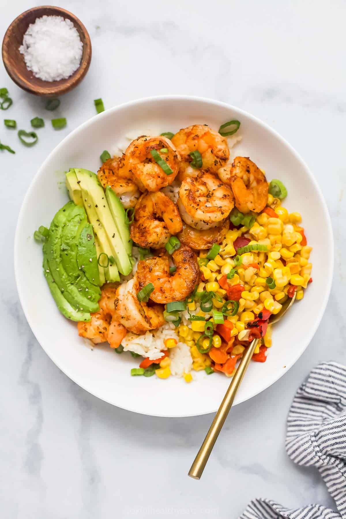 Overhead view of blackened shrimp bowl and small bowl of flaky salt