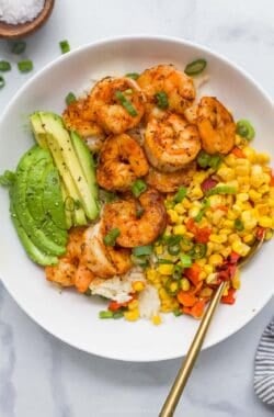 Overhead view of blackened shrimp bowl with spoon