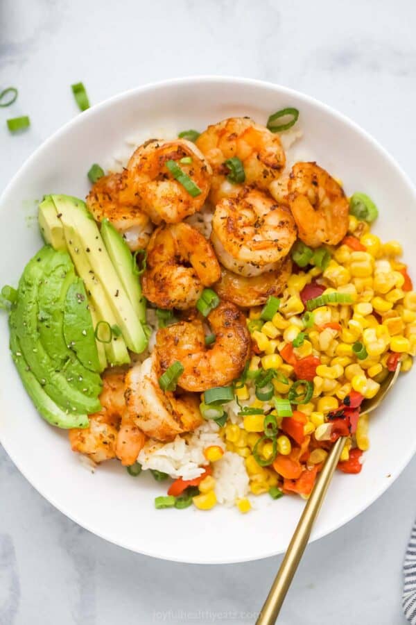 Overhead view of blackened shrimp bowl with corn relish