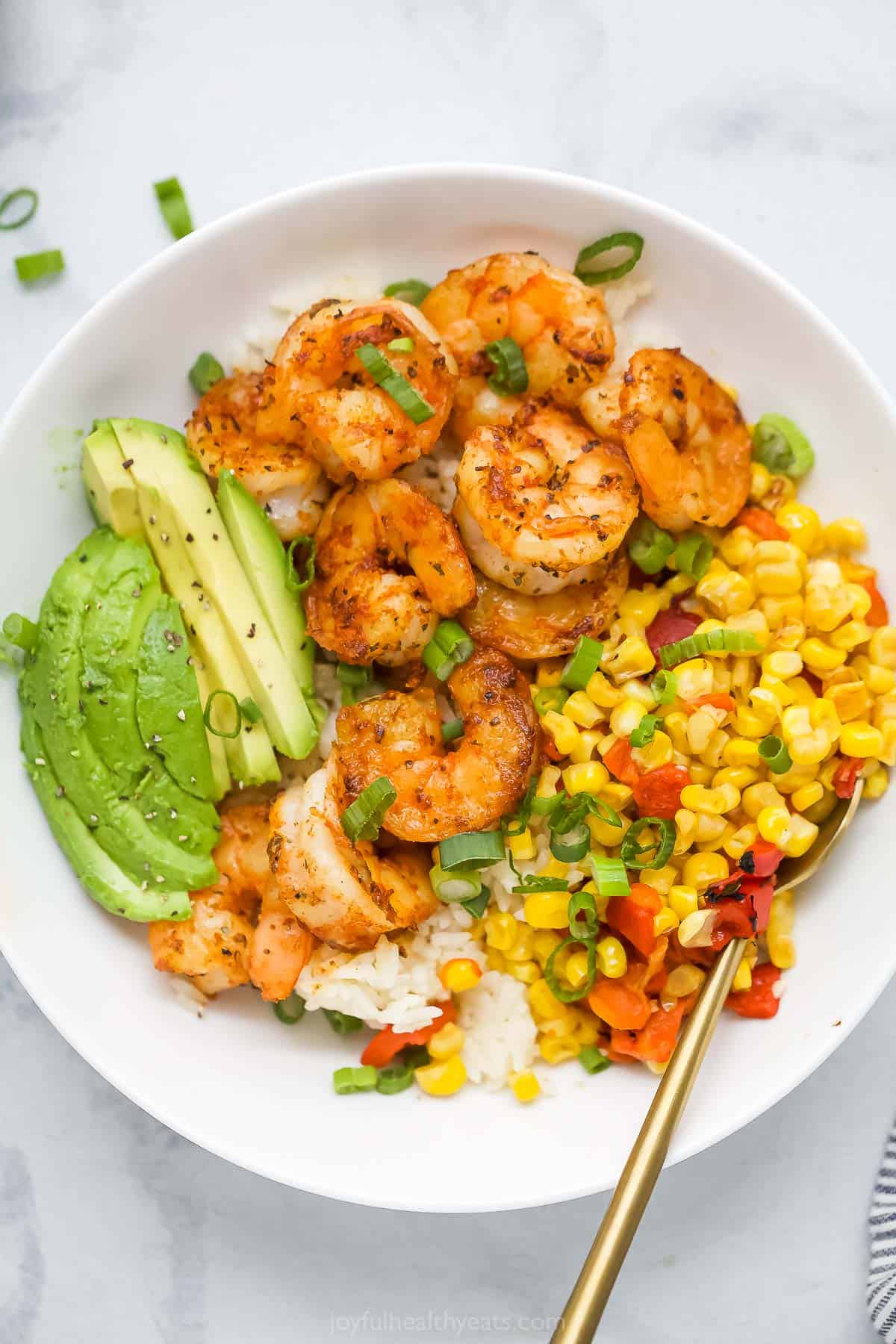 Overhead view of blackened shrimp bowl with corn relish