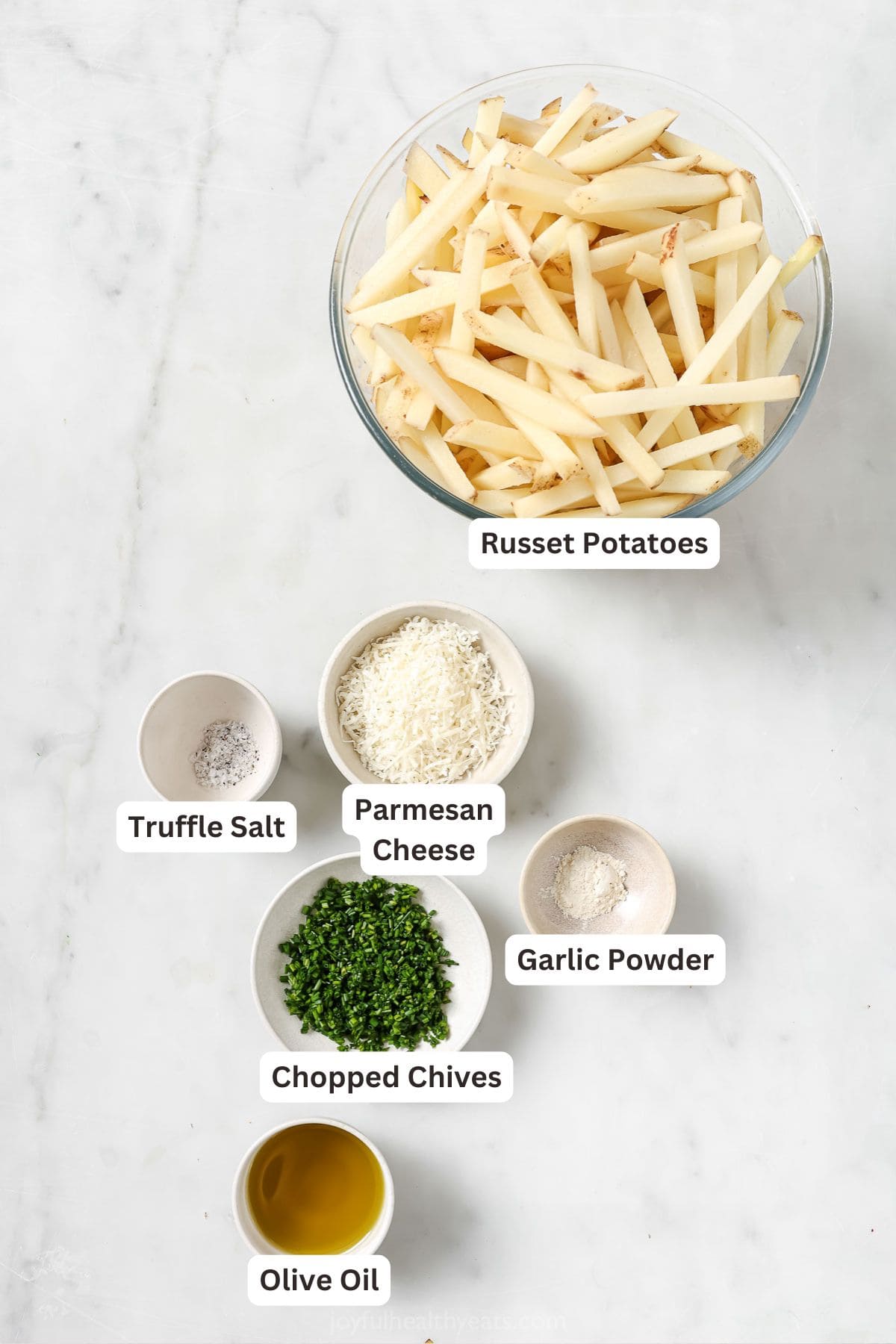 Cheesy Parmesan Truffle Fries are the perfect snack or party app when you’re feeling a little fancy. Baked in the oven and super crispy! Overhead view of ingredients for Parmesan truffle fries