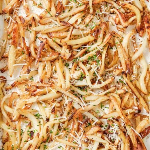 Overhead view of Parmesan truffle fries on pan