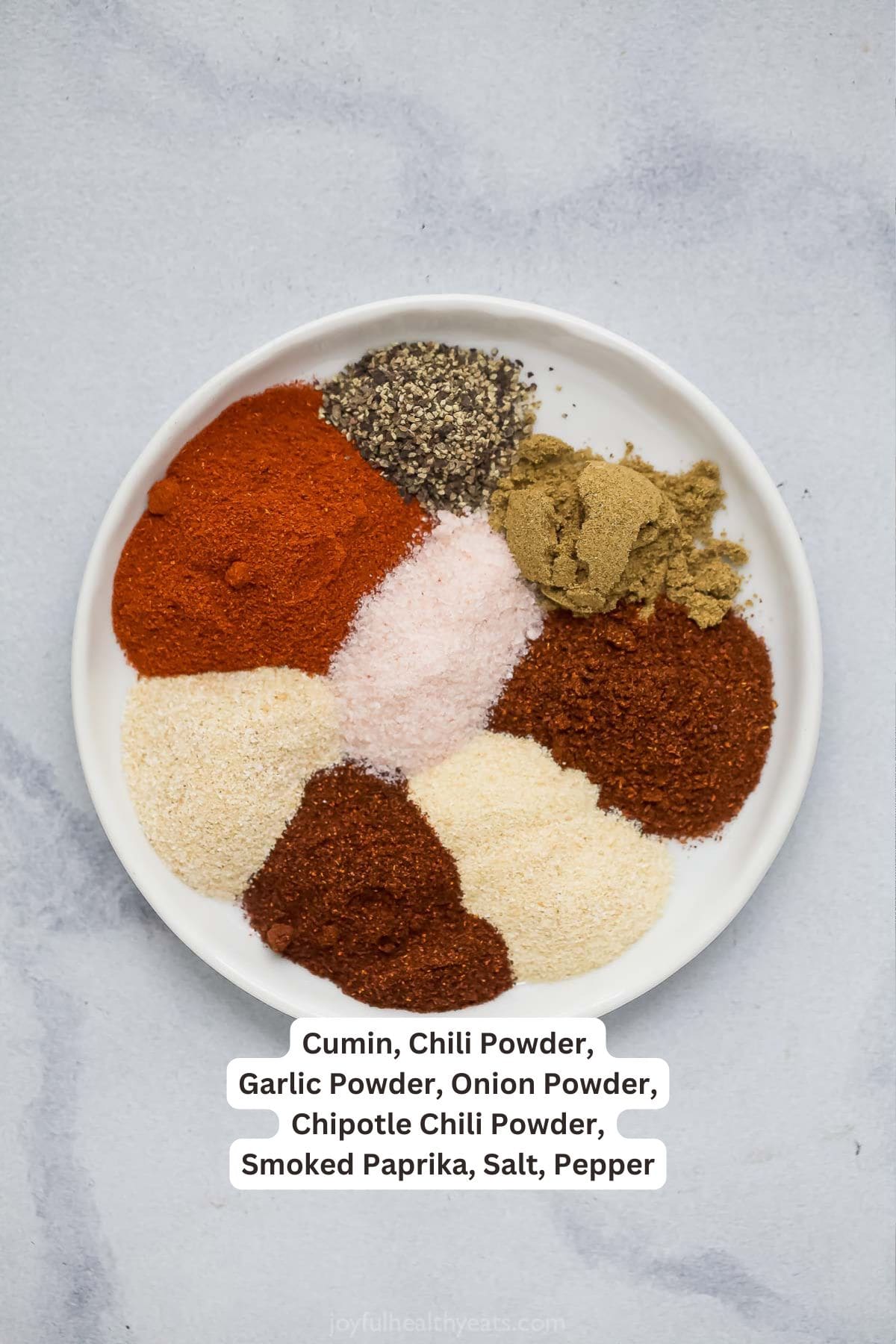 This Southwest Spice Blend is a multitasker, adding flavor to everything from shrimp and chicken to ribs. Smoky, savory and a bit spicy! Overhead view of Southwest spice blend ingredients on plate