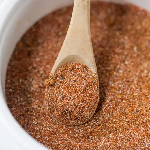 Spoon scooping Southwest spice blend from bowl
