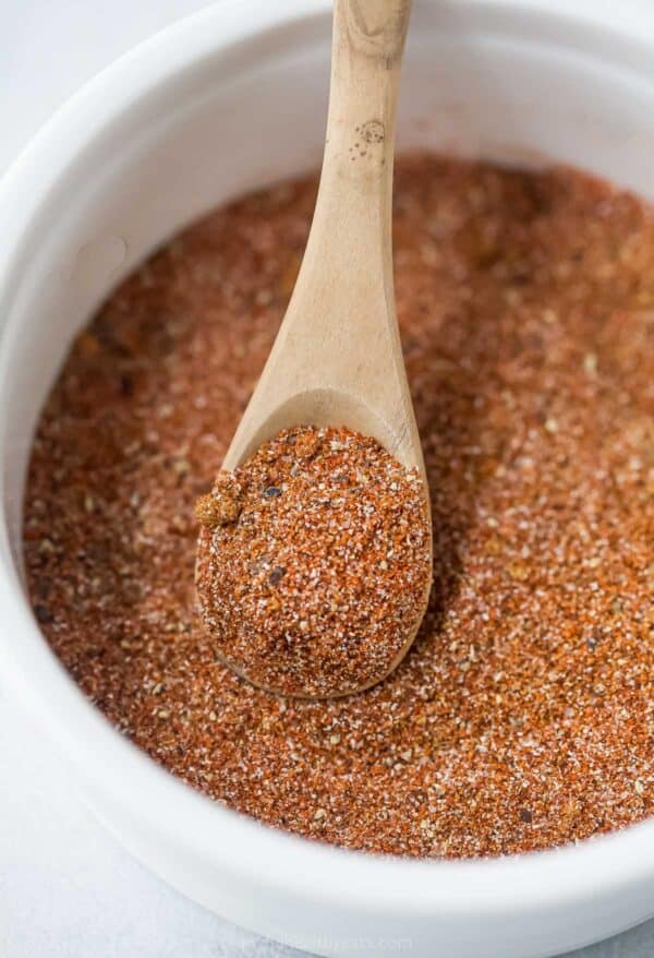 Spoon scooping Southwest spice blend from bowl