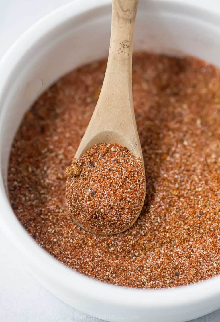 Spoon scooping Southwest spice blend from bowl
