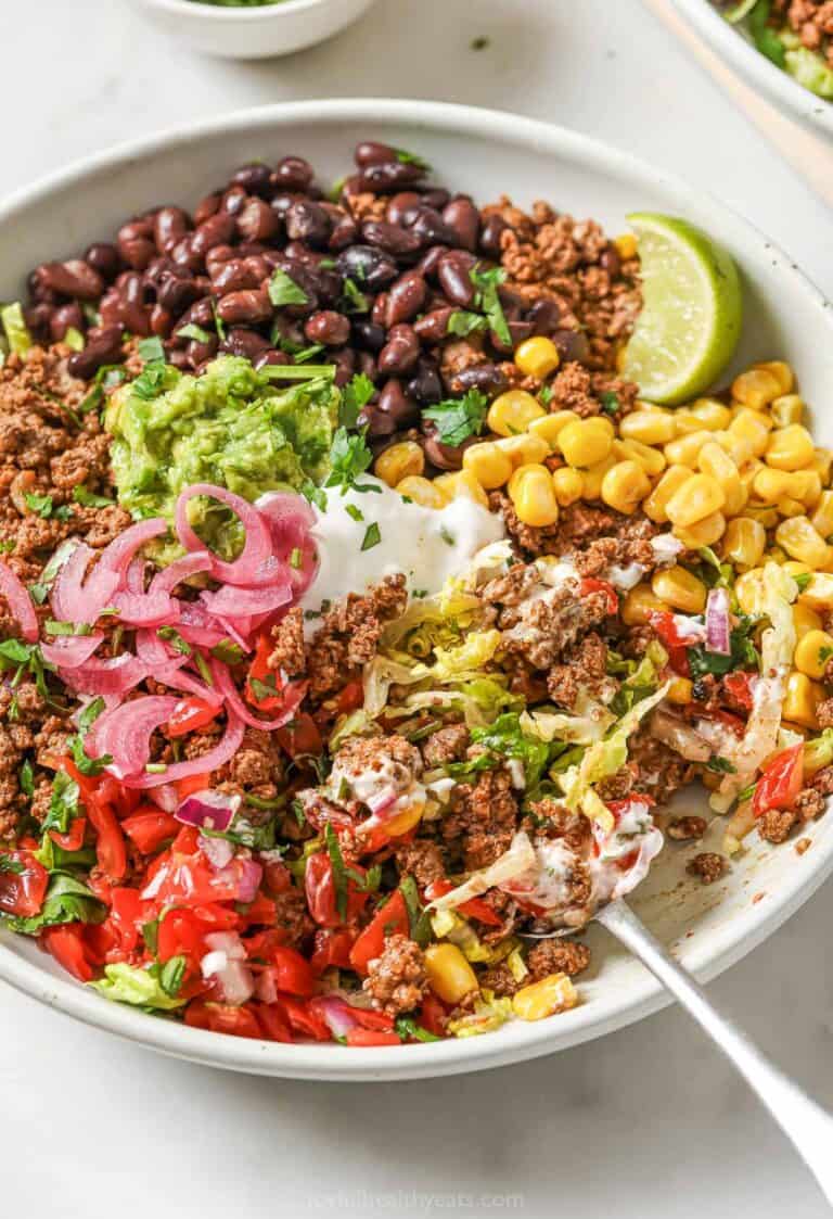 Taco salad bowl with black beans, beef, and corn
