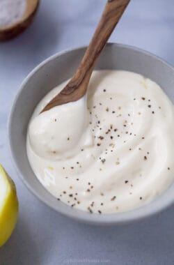 Homemade truffle aioli in bowl with spoon