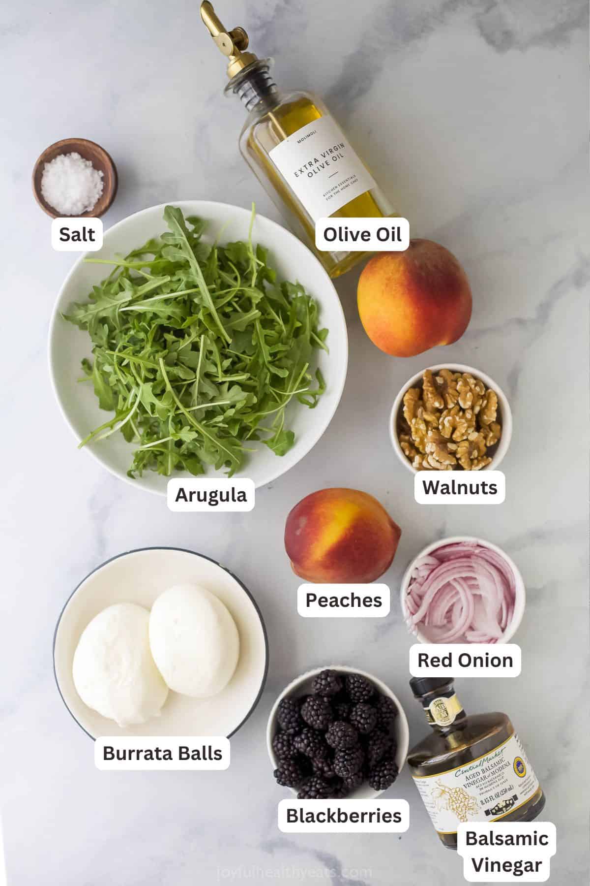 Overhead view of ingredients for burrata and grilled peach salad