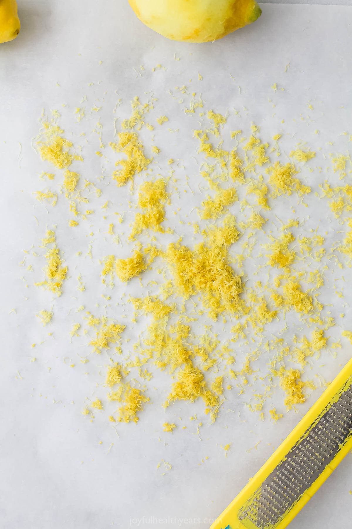 Add a pop of citrus to chicken, seafood, and more with this easy homemade Lemon Pepper Seasoning. It's so much tastier than store-bought! Fine lemon zest on countertop