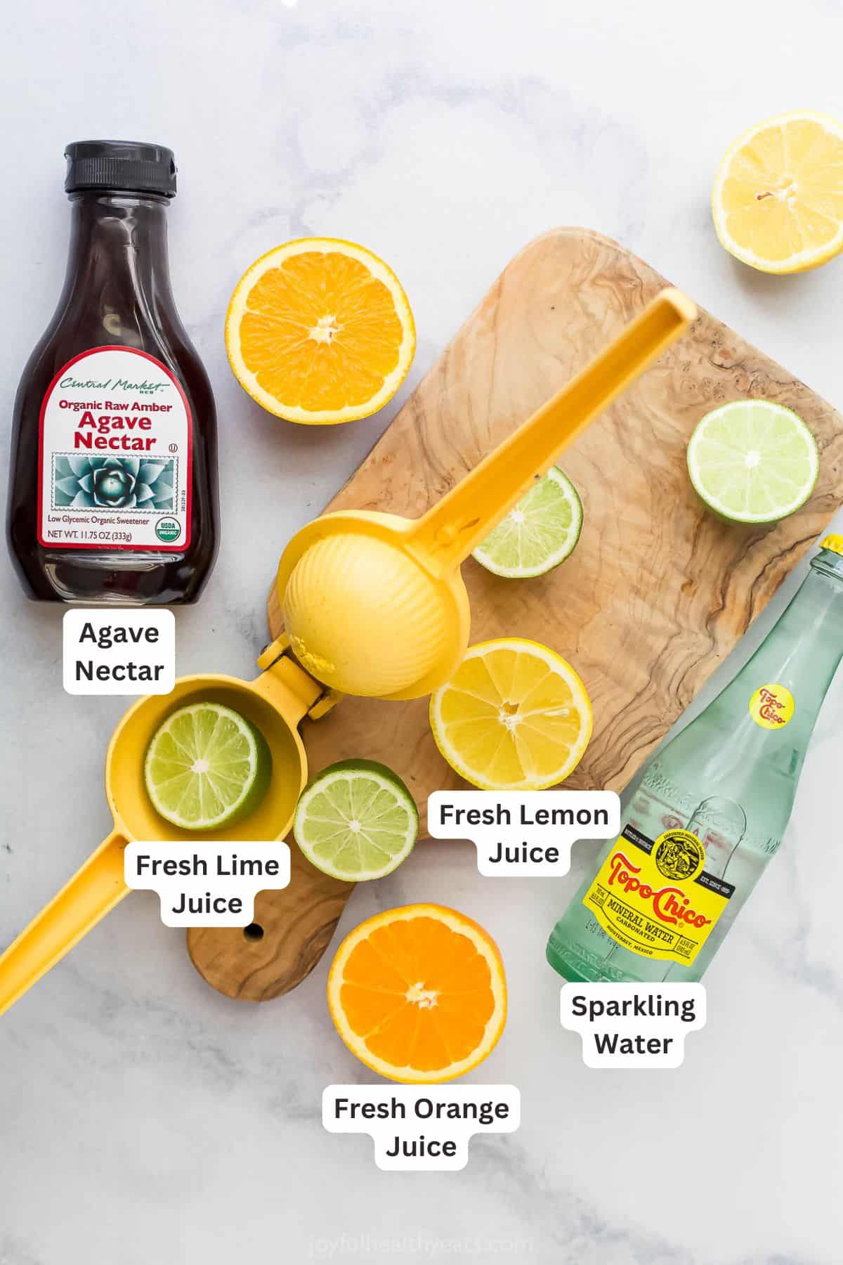 This Margarita Mocktail recipe is made without the alcohol but ALL the flavor, with a blend of fresh citrus juice, agave and sparkling water. Overhead view of ingredients for margarita mocktails
