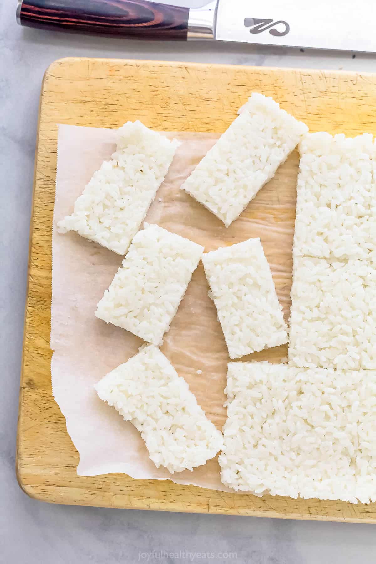 This Spicy Tuna Crispy Rice is a Nobu copycat that’s sure to impress! It’s easy to make, with ahi tuna topping crispy cubes of sushi rice. Overhead view of rice cut into rectangles