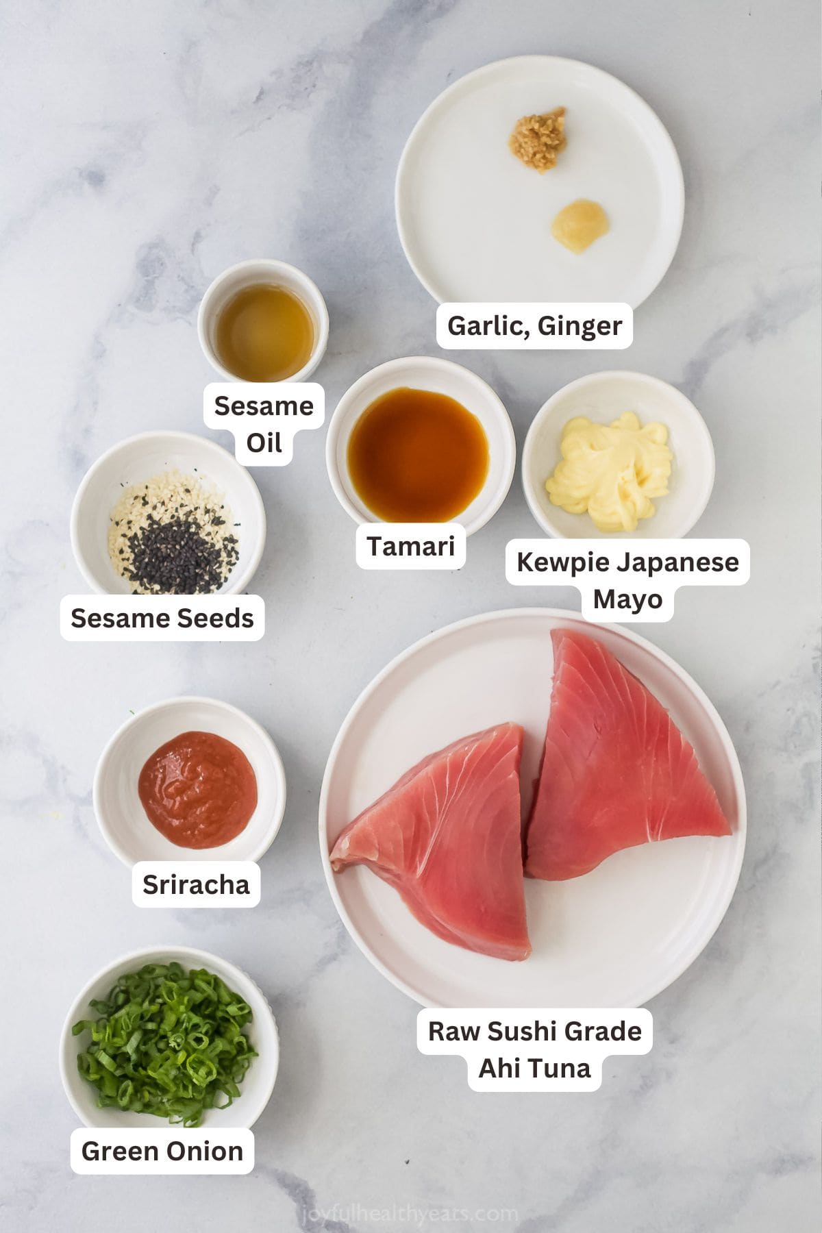 Spicy tuna is an easy Asian-style recipe that can be added to salad, meal bowls, sushi, and more. It's so simple, but SO delicious! Overhead view of ingredients for spicy tuna
