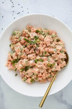 Bowl of spicy tuna with gold spoon