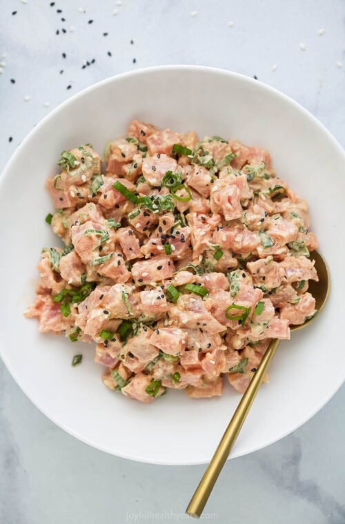 Bowl of spicy tuna with gold spoon