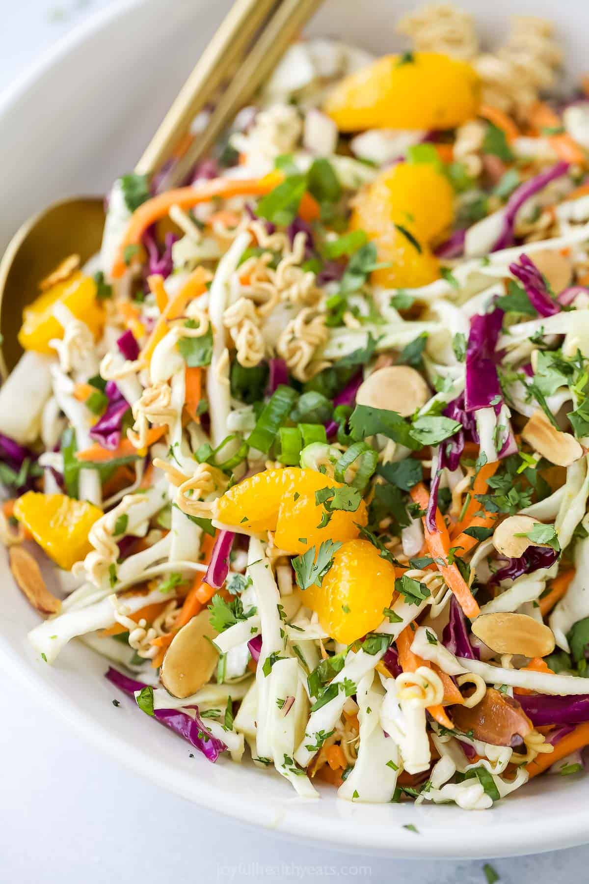 Crunchy, crisp, and sweet Ramen Noodle Salad is a classic! I’ve given it a more modern spin, but it still has that familiar flavor you love. Closeup of ramen noodle salad with mandarin oranges