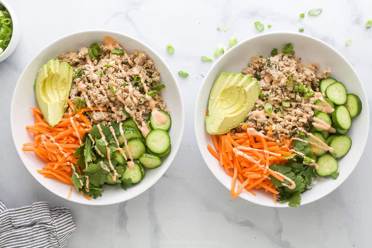 Overhead view of two banh mi bowls with ground turkey