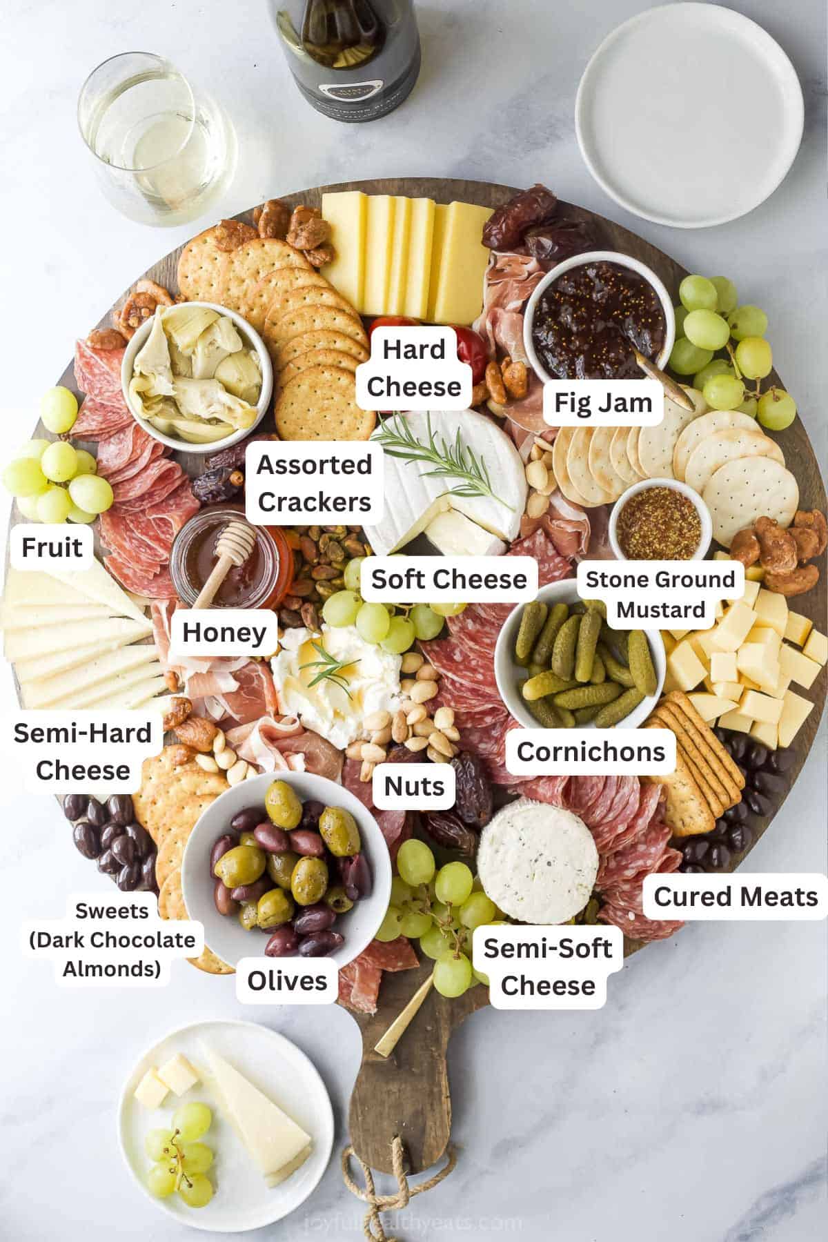 Overhead view of ingredients for a charcuterie board