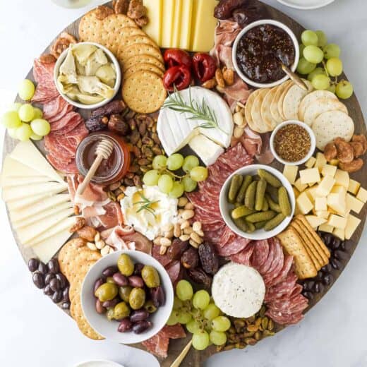 Overhead view of charcuterie board with cured meats and cheeses