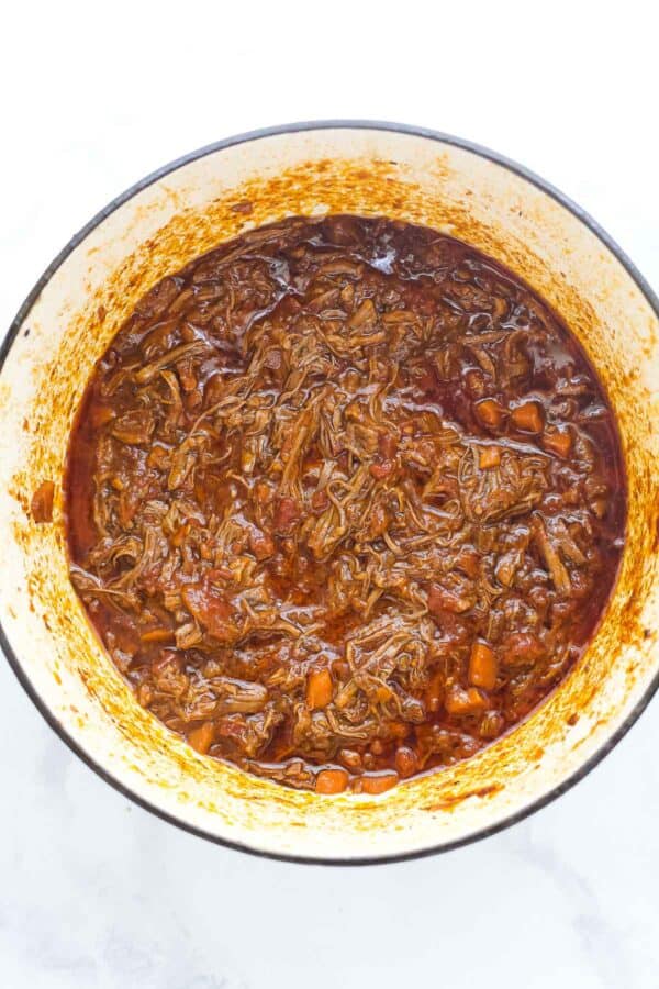 Overhead view of short rib ragu in Dutch oven