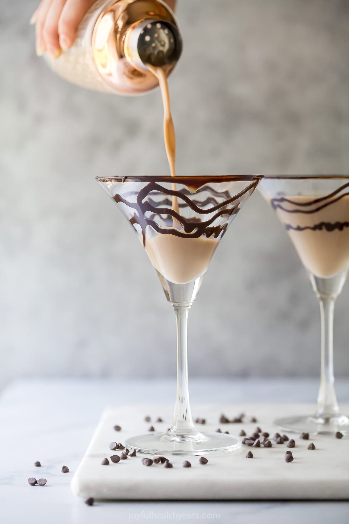 Pouring chocolate martini into prepared glass.