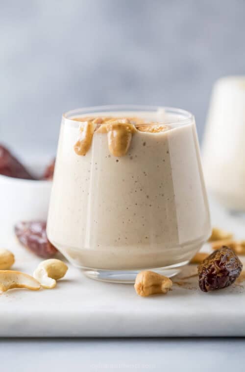 Creamy date protein shake in glass.