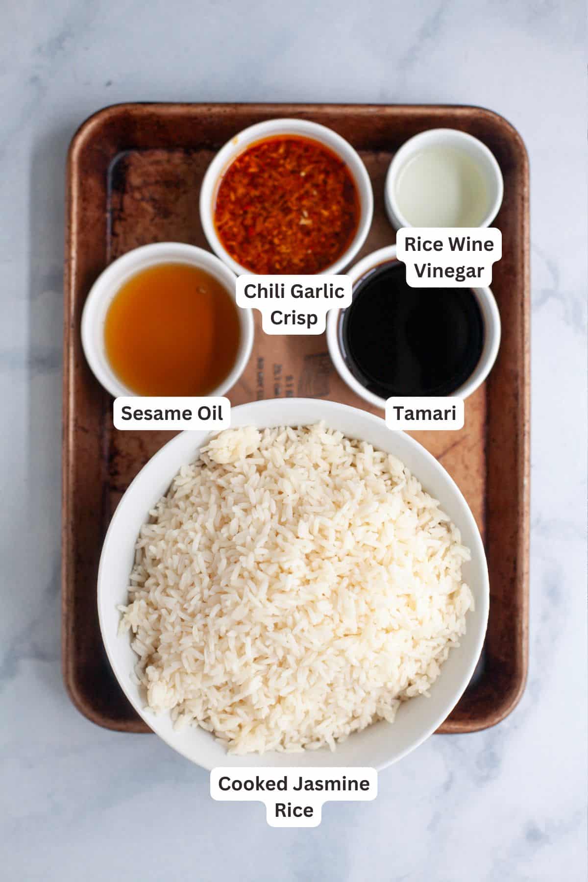 This viral TikTok sheet pan crispy rice is tossed in savory sauce and baked until golden for the perfect addition to salads, bowls and more! Ingredients for sheet pan crispy rice.