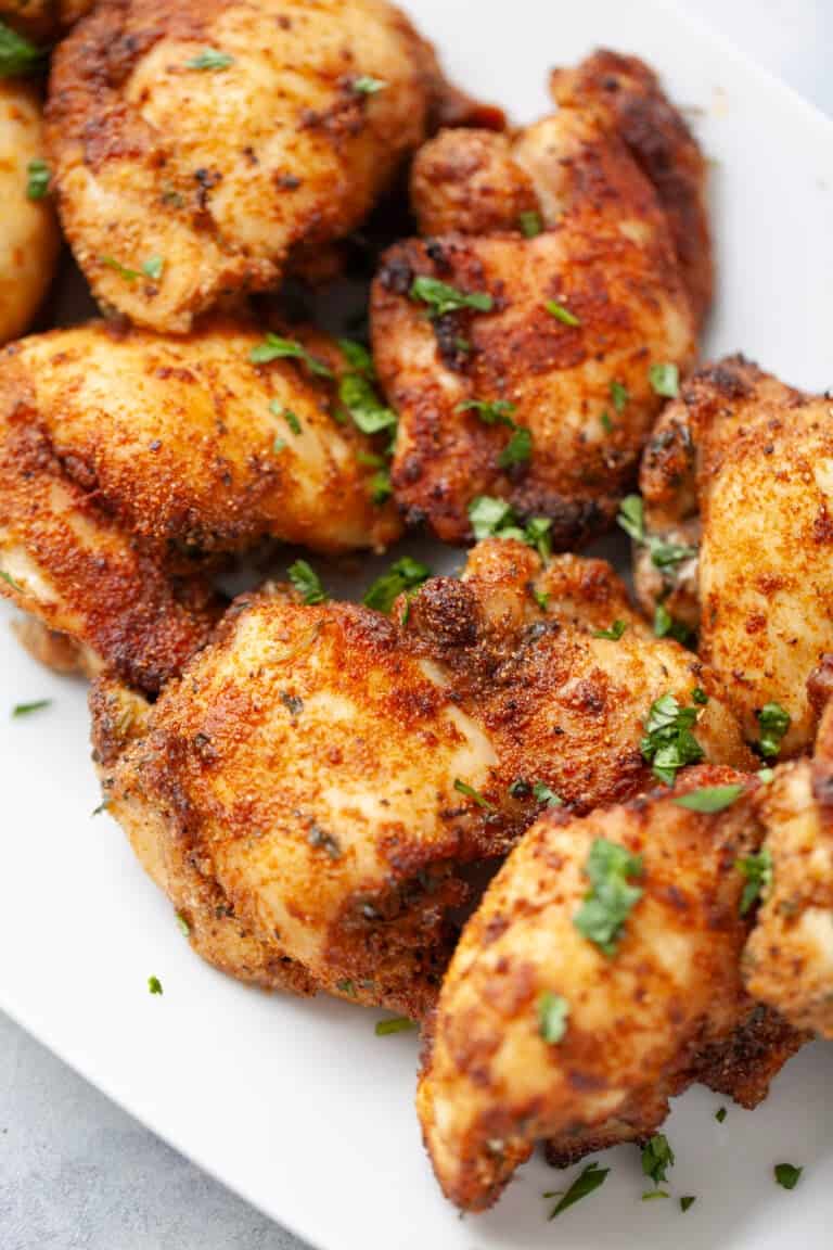 Platter of crispy air fryer chicken thighs.