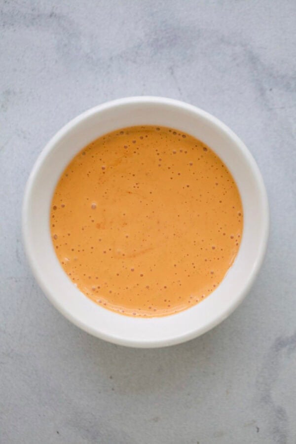 Creamy gochujang sauce in bowl.
